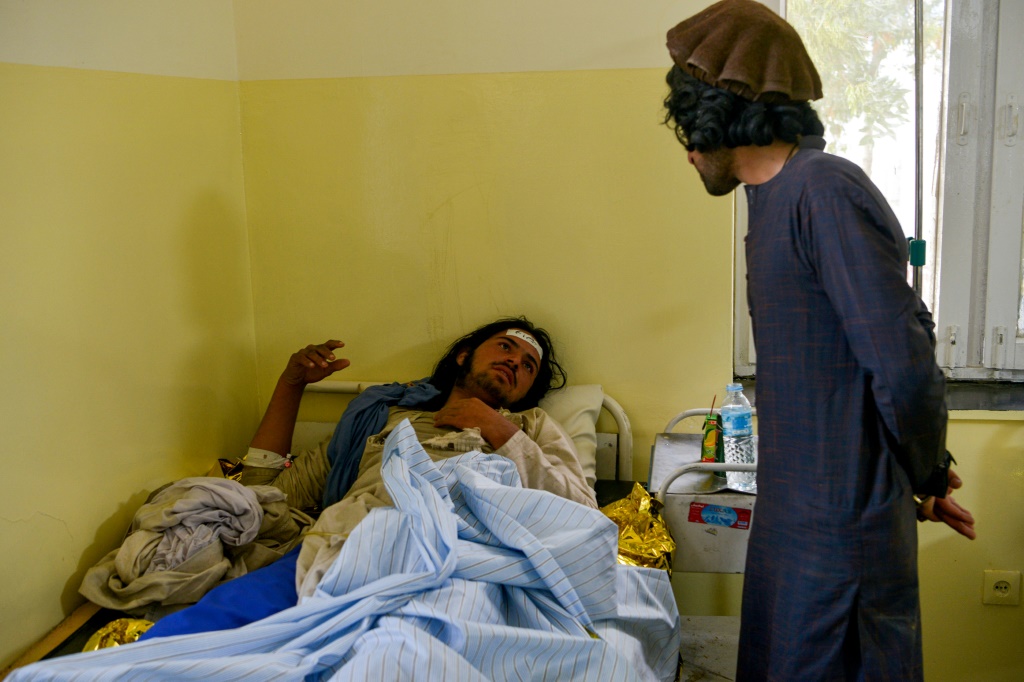 An Afghan man is treated inside a hospital in Sharan