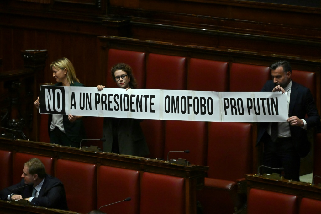 Members of the centre-left Democratic Party held up a banner in parliament reading: 'No to a homophobic and pro-Putin speaker'