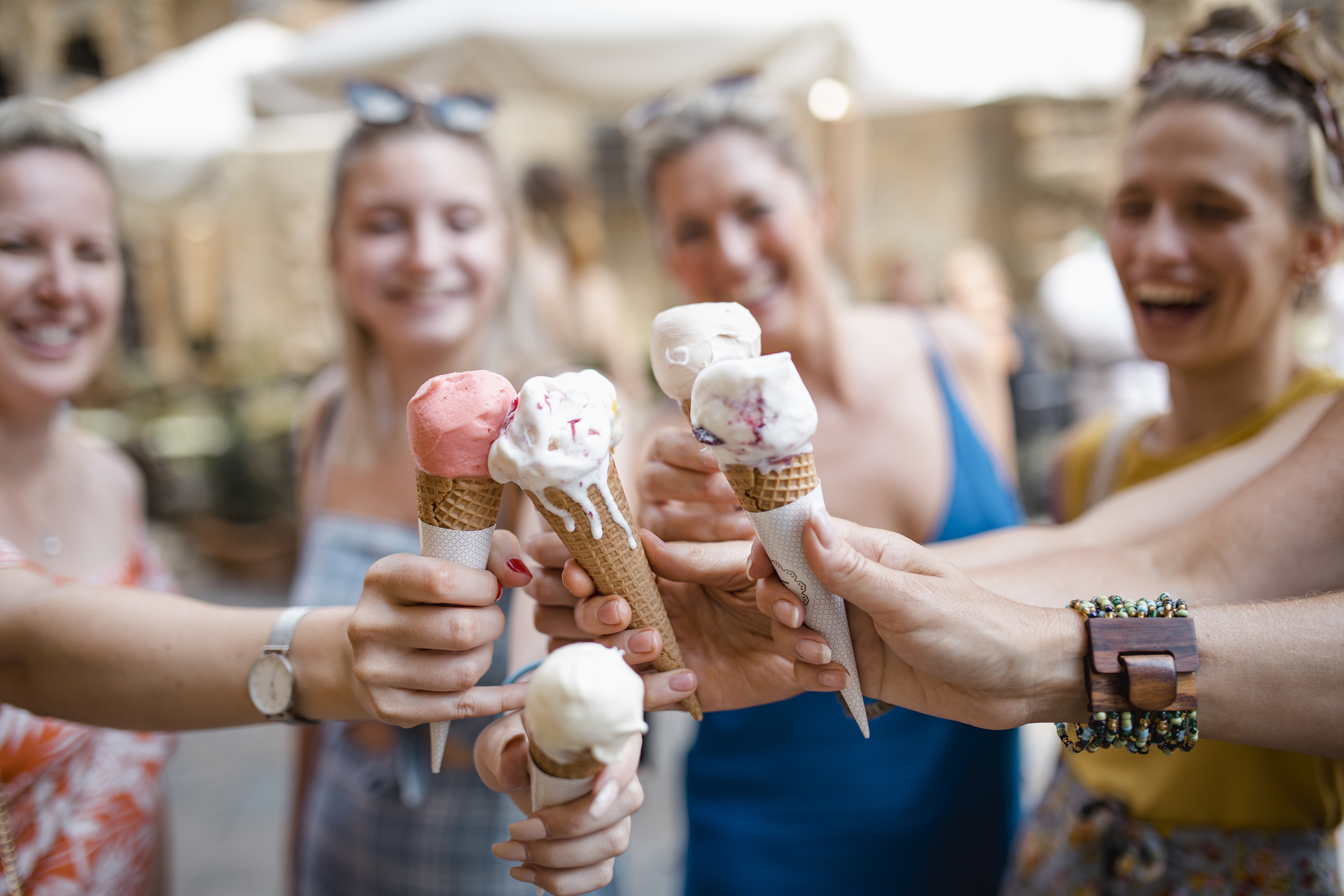 A small group of women enjoy ice cream in Volterra, Italy.