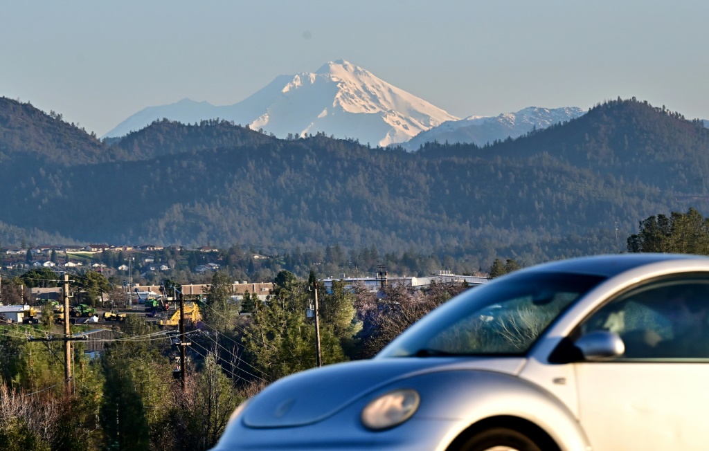 A motorist drives in Redding, a small northern California  city in the shadow of snow-covered Mount Shasta.
