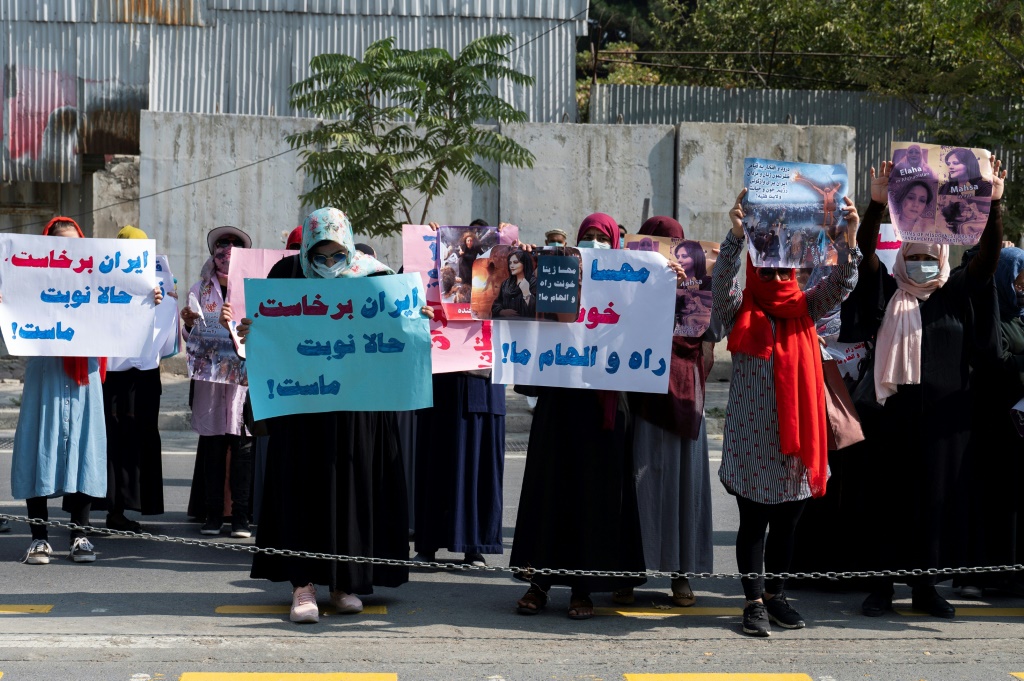 Afghan women protested in front of the Iranian embassy in Kabul on September 29, 2022 before Taliban forces fired shots into the air