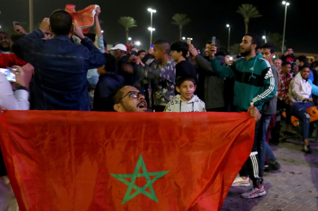 Morocco's supporters in the Libyan capital Tripoli celebrate after their team beat Spain in the World Cup