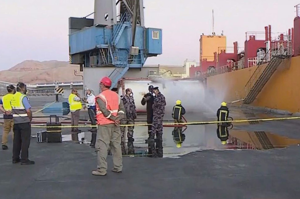 Footage on state TV showed a large cylinder plunging from a crane on a moored vessel in Jordan's Aqaba port, causing a violent explosion of yellow gas