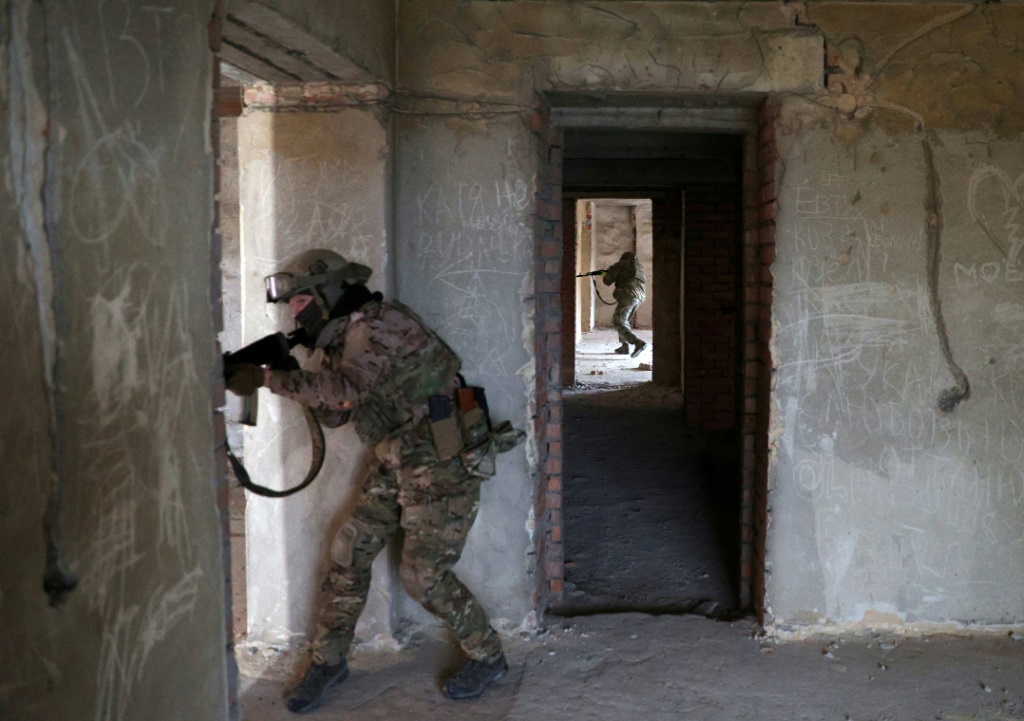 Ukrainian soldiers train in an abandoned building in Sloviansk