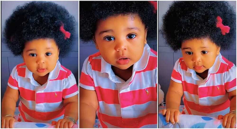 Photos of a beautiful baby with dark natural hair.