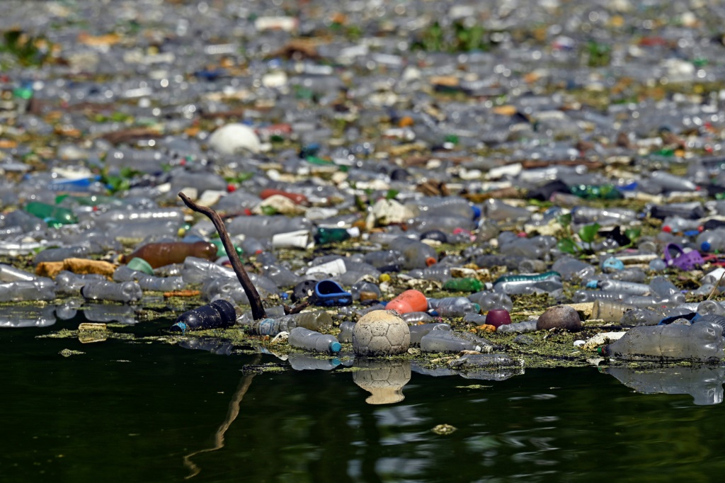 Plastic waste floats on the Cerron Grande reservoir in Potonico, El Salvador