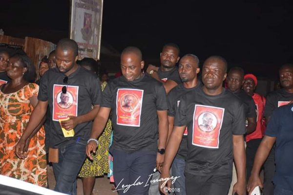 A group of people wearing black shirts