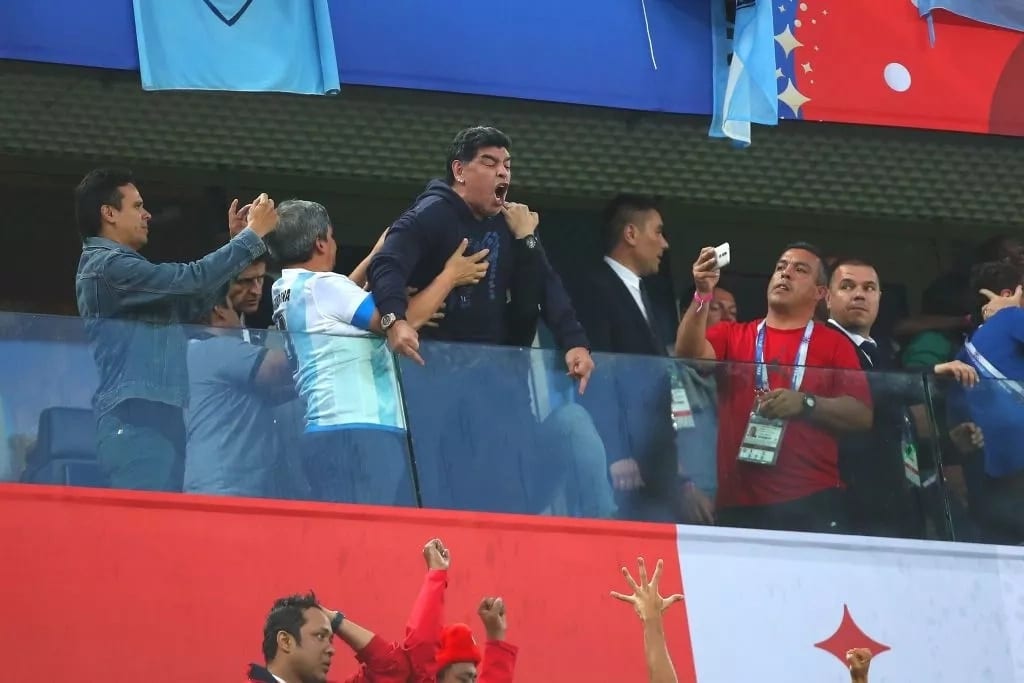 Argentina's legend Maradona in middle-finger celebration after his side's narrow escape