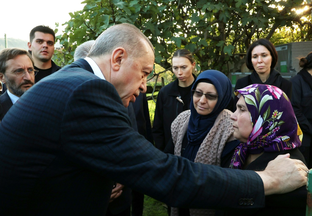President Recep Tayyip Erdogan (L)at the funeral of a dead miner