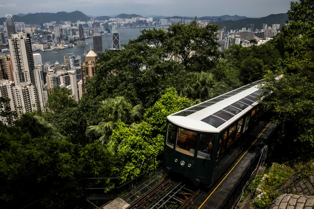 The Peak Tram reopened Saturday after a year-long $102 million facelift even as the city's coronavirus curbs continue to keep overseas visitors at bay