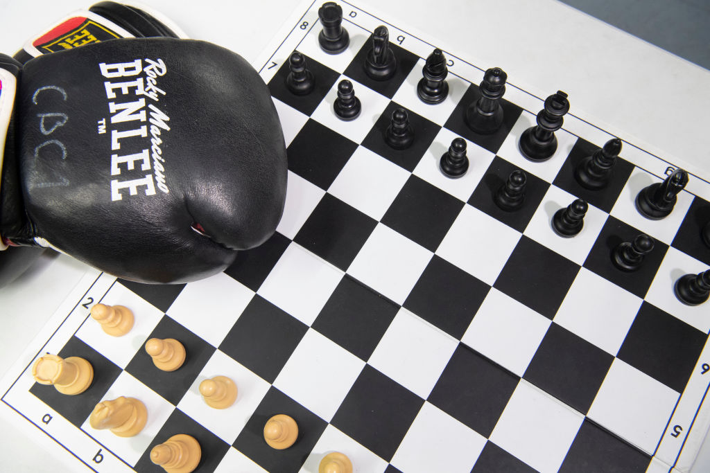 Boxing gloves on a chess board
