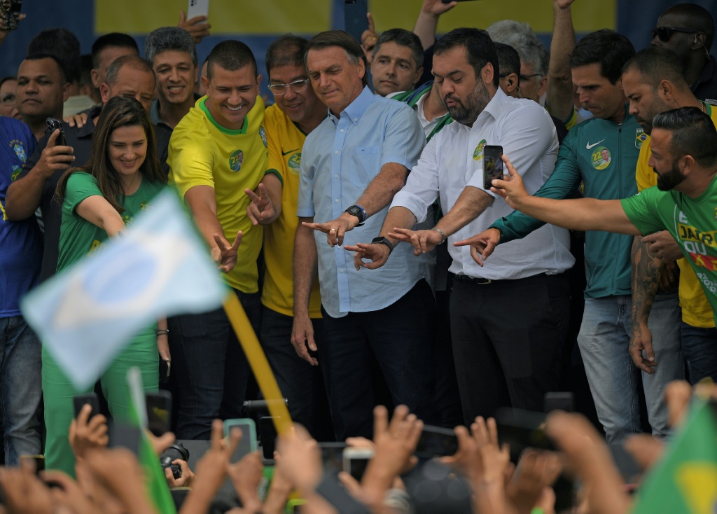 Bolsonaro greets supporters at a rally