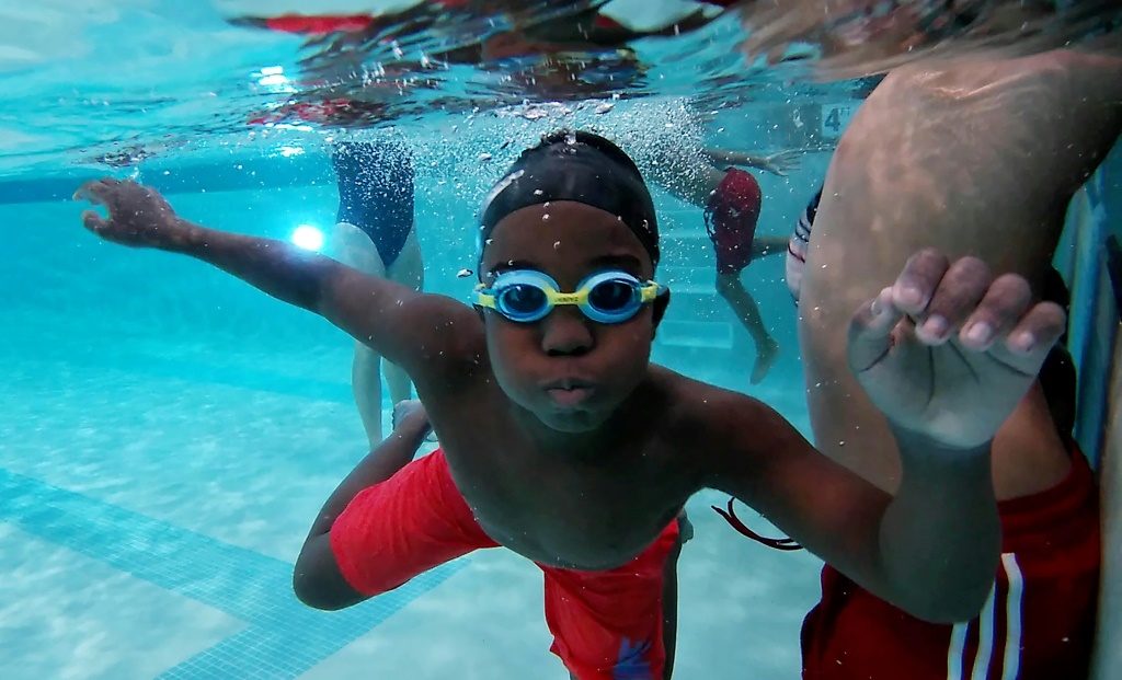A Black youth takes part in a class sponsored by Swim Up, which promotes swimming among African Americans