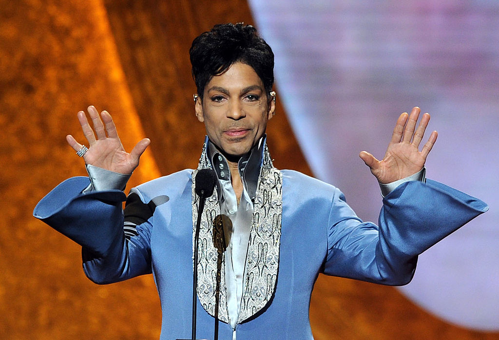 Prince Rogers Nelson in a blue outfit.