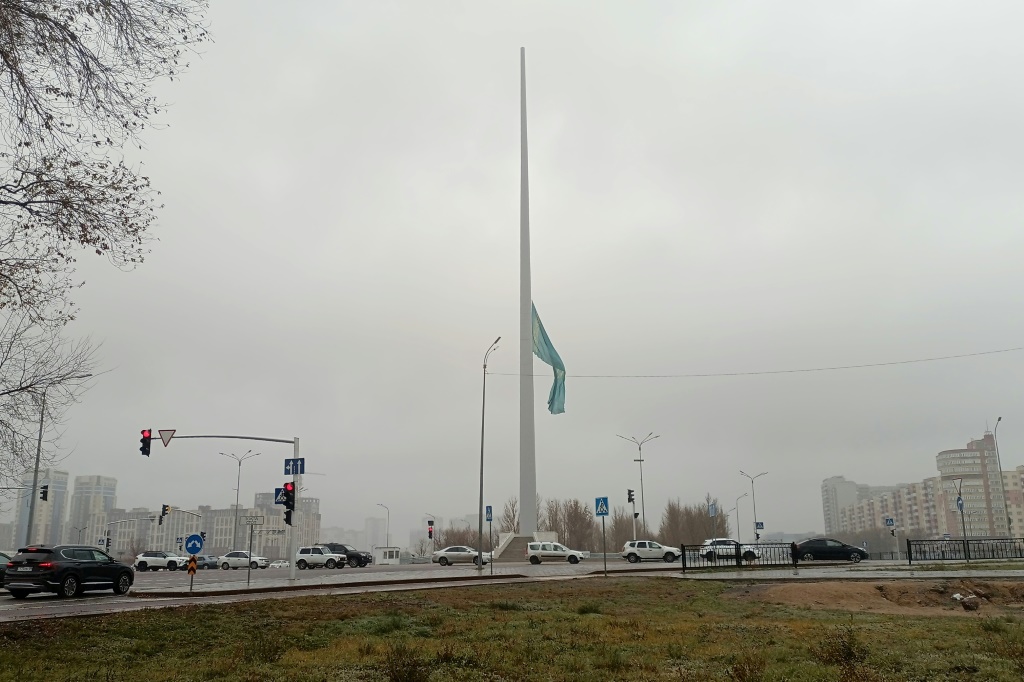 The Kazakh national flag flies at half-mast to mark a day of national mourning for the dead miners