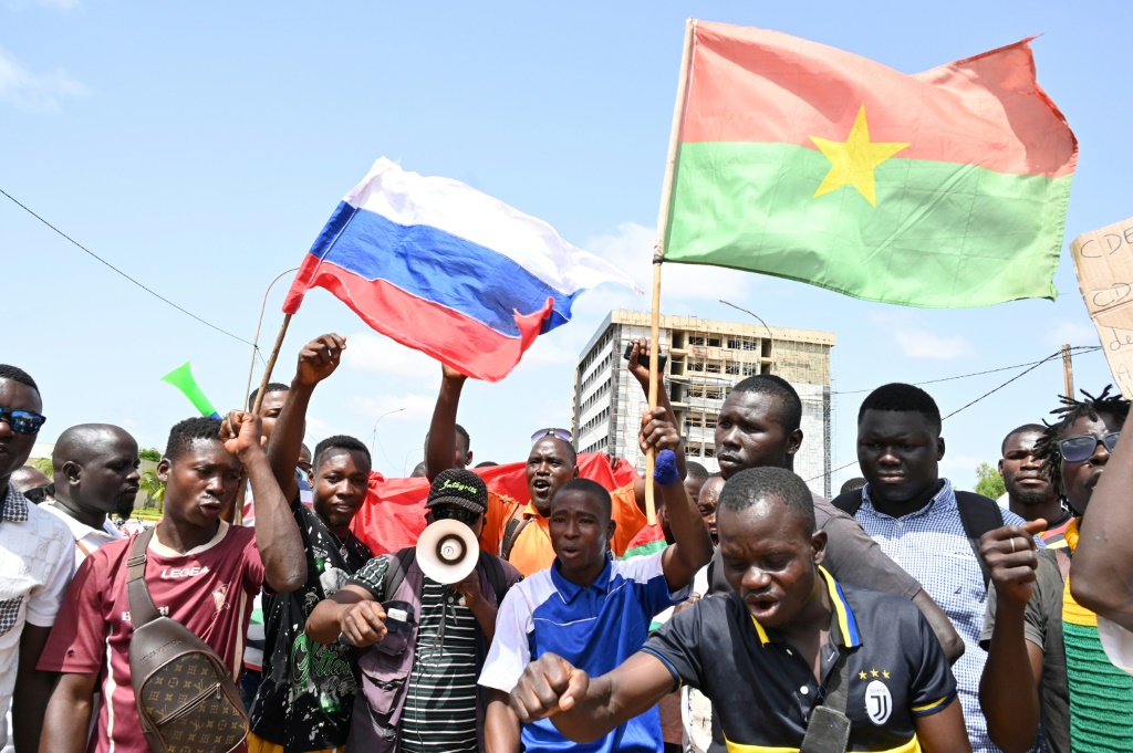 Demonstrators waved Russian and Burkina flags in a protest against West African bloc ECOWAS