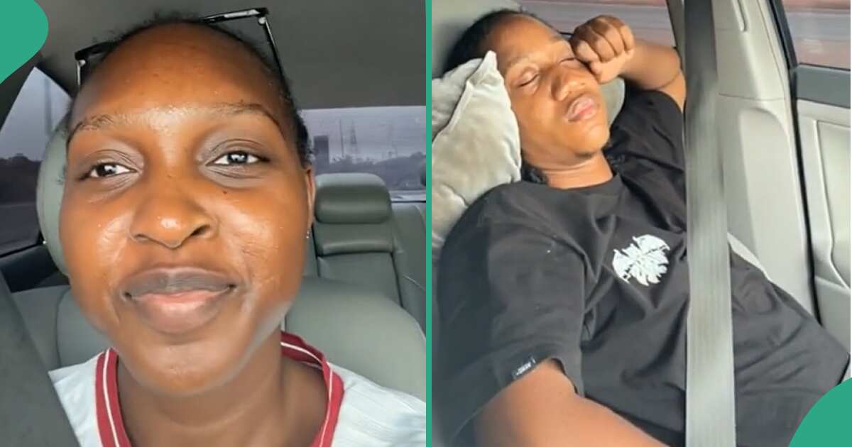 Lady happy as her man sleeps while she drives.