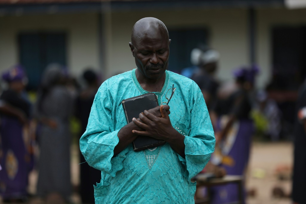 A father prays for the return of his children after students were abducted from Bethel Baptist High School in  Kaduna state last year