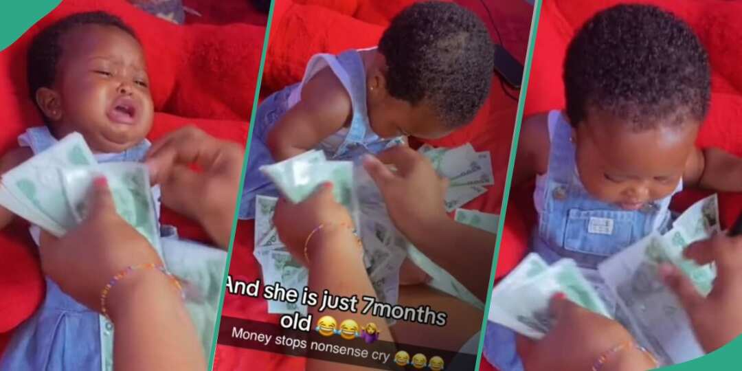 Crying baby keeps shut after getting sprayed cash