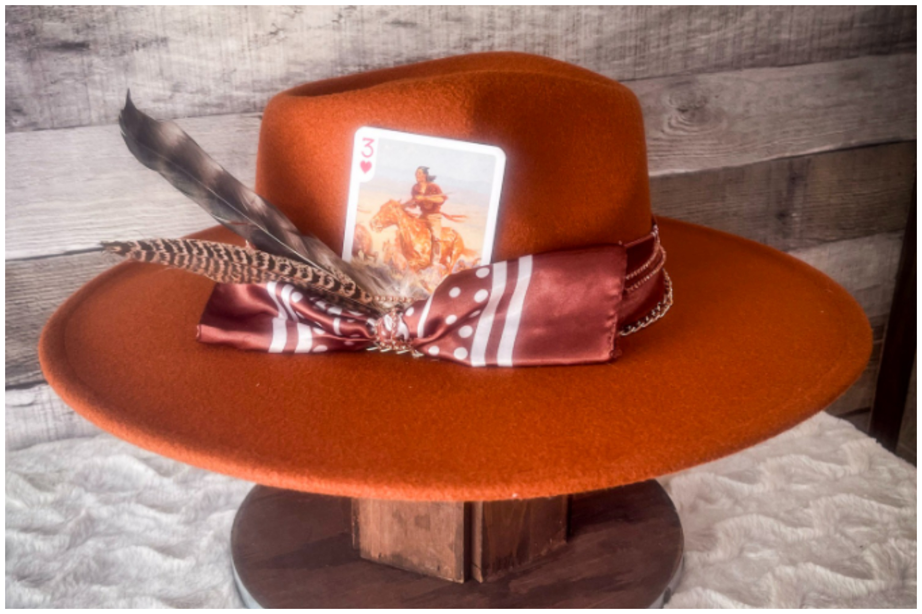 An orange-brimmed hat with embellishments