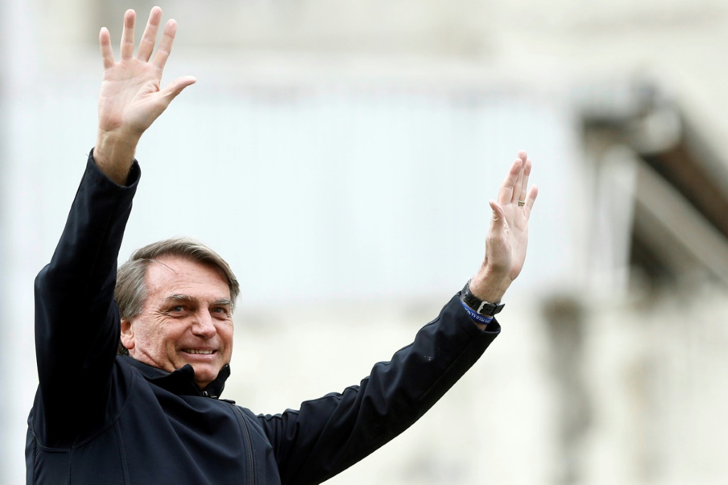 Brazil's President and presidential candidate Jair Bolsonaro gestures during a rally as part of his re-election campaign in Curitiba, Parana State, Brazil, on August 31, 2022