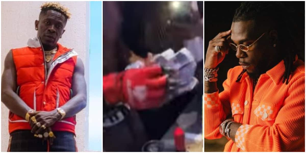 Burna Boy watches boxing match with people