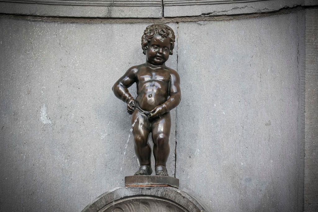 The Manneken Pis or le Petit Julien statue in Brussels, Belgium.