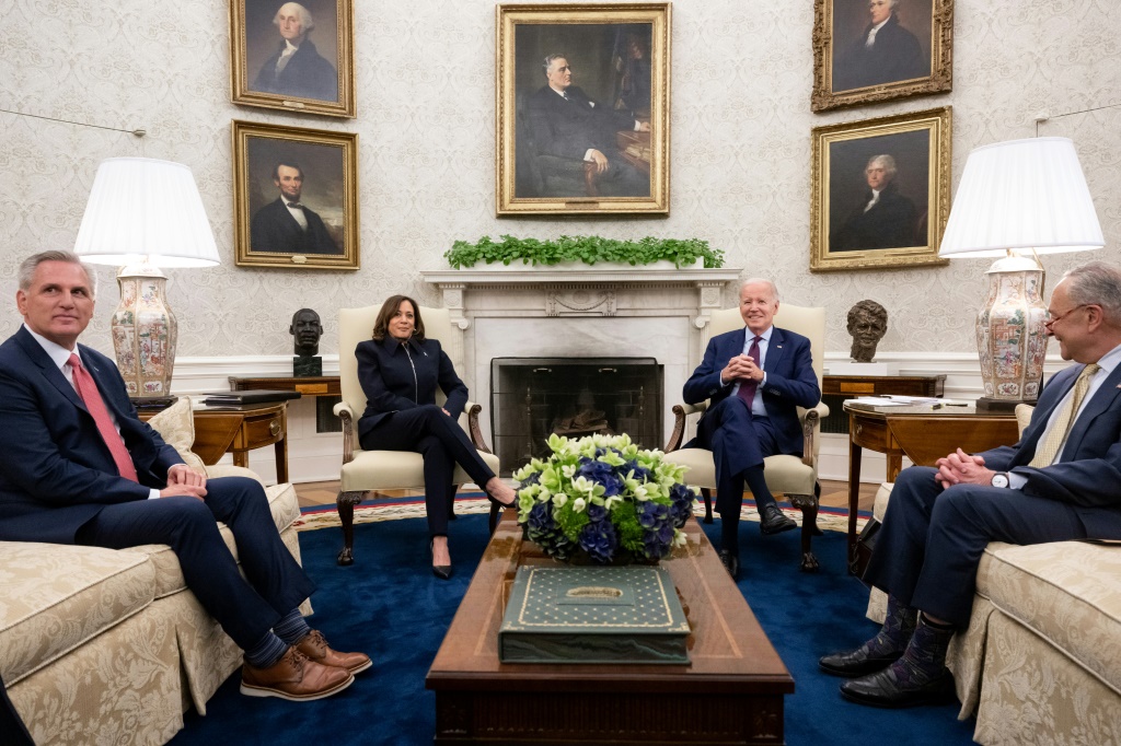 US President Joe Biden (2R) speaks during a meeting on the debt limit with (L-R) US House Speaker Kevin McCarthy (R-CA), US Vice President Kamala Harris, and Senate Majority Leader Chuck Schumer (D-NY) in the Oval Office of the White House in Washington, DC, on May 16, 2023.