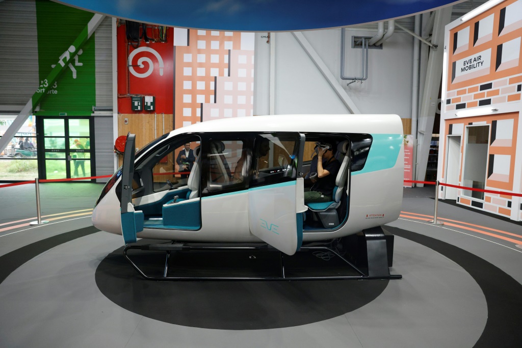 Brazil's Embraer and its subsidiary Eve Air Mobility say they will begin manufacturing electric flying taxis, a model cabin of which is seen here at a Paris air show in June 2023, at a factory near Sao Paolo as early as 2026