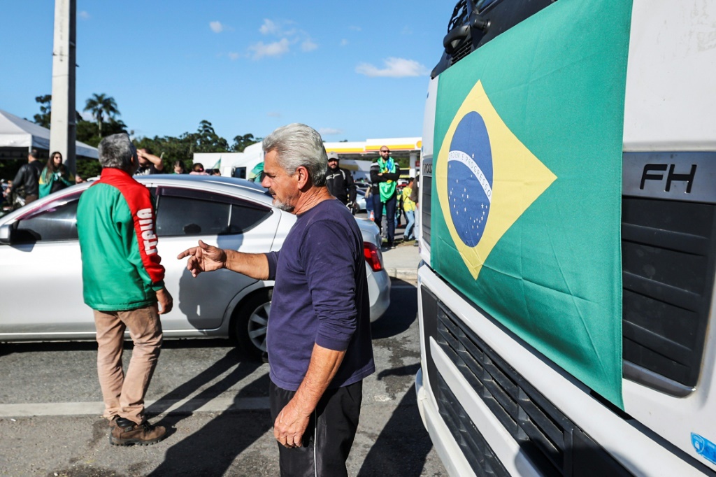Supporters of Brazilian President Jair Bolsonaro at a road blockade after his election defeat