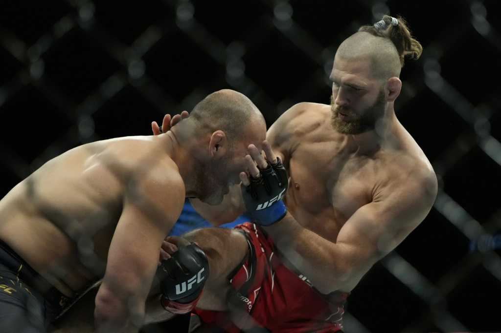 Jiri Prochazka, right, became the first UFC world champions from the Czech Republic when he beat Brazil's Glover Teixeira, left, in Singapore in June