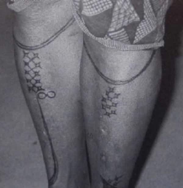 Photos of tattooed legs.
