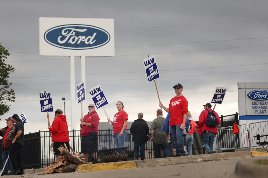 UAW workers, shown picketing outside of Ford's Wayne Assembly Plant last month, are returning to work after the company announced a tentative agreement with the United Auto Workers union