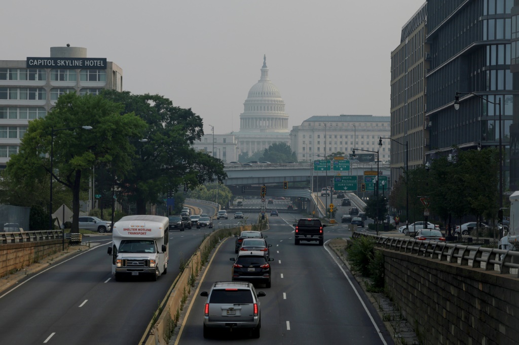 JUNE 29: Cars drive in hazy smoke on South Capitol Street towards the U.S. Capitol Building on June 29, 2023 in Washington, DC