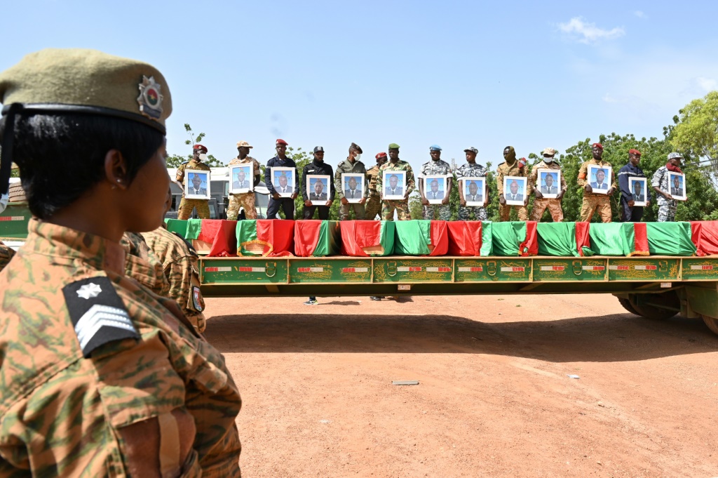 Toll: A funeral for 27 soldiers who were killed in an ambush in August as they escorted a large convoy of truck in the north of the country