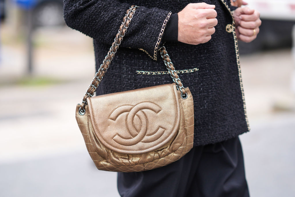 An elegant brown Chanel bag featuring the iconic double C logo.