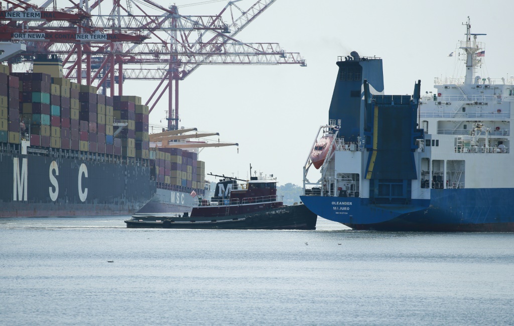 A ship departs from the Port Newark container terminal in Newark, New Jersey on July 21, 2022