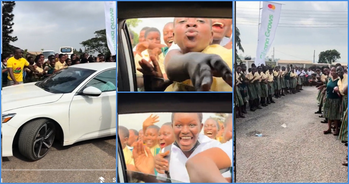 Aburi Girls SHS students mob Demzy Baye and other DWP members as they visit school