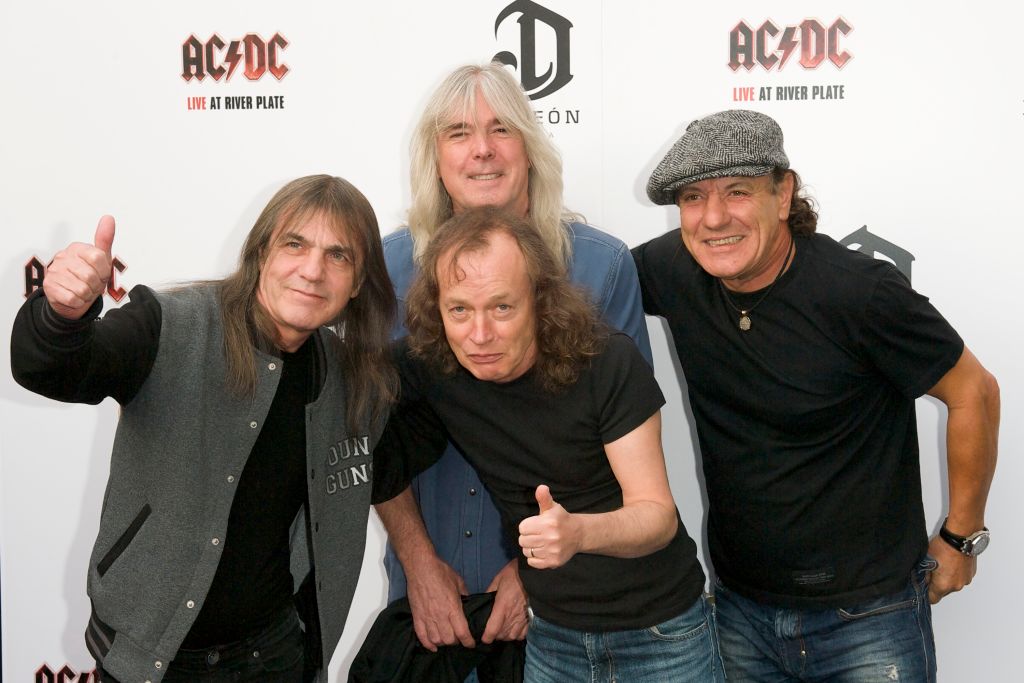 From L to R: AC/DC band members Malcolm Young, Cliff Williams, Angus Young and Brian Johnson.
