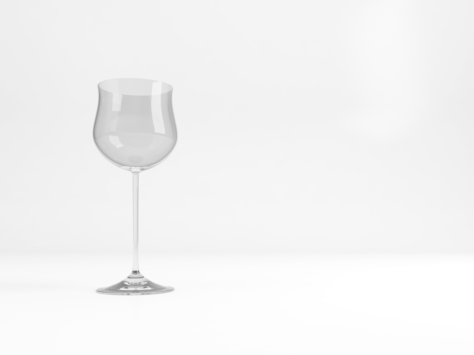 A hock wine glass on a transparent surface