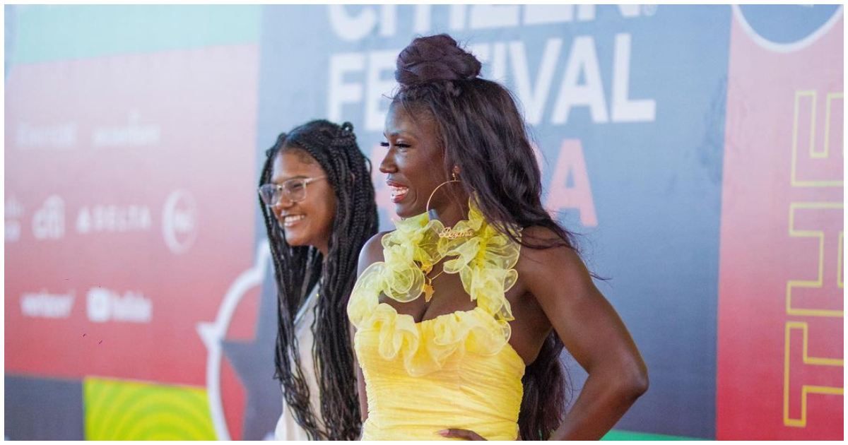 Netflix & Uber's Bozoma Saint John attends Global Citizen Festival in yellow dress and Nike sneakers