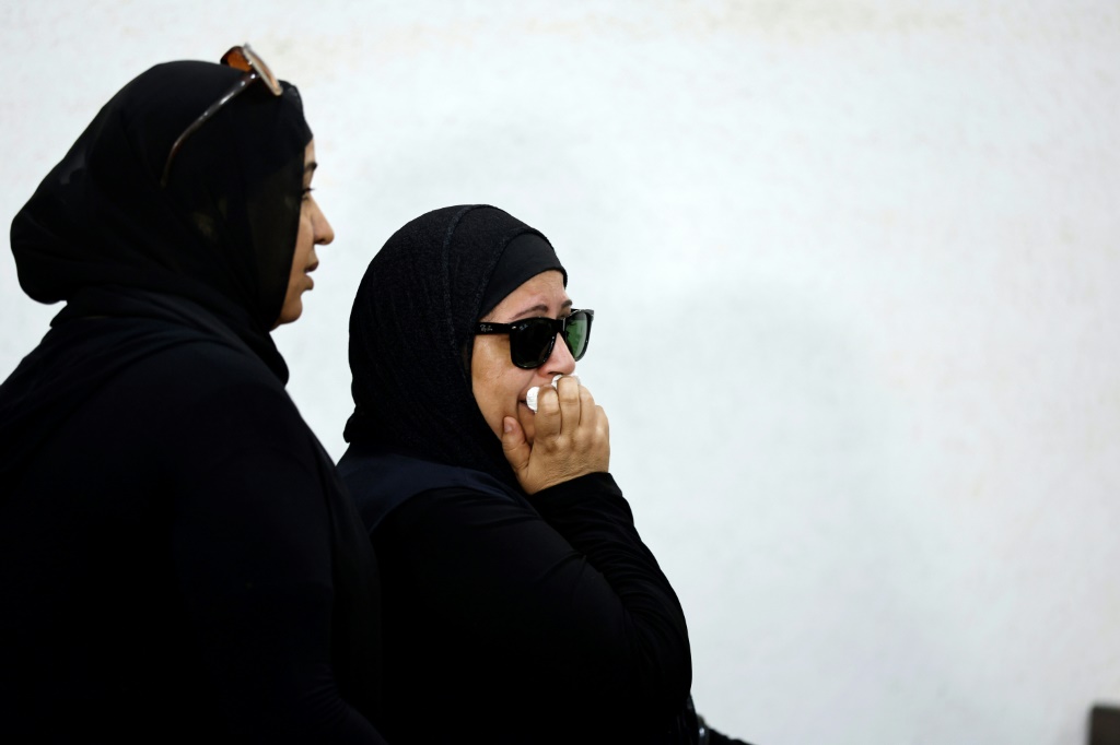 The mother of murdered university of Mansoura student Nayera Ashraf, reacts as she attends the first trial session of the alleged murderer Mohamed Adel, in Mansoura north of Cairo