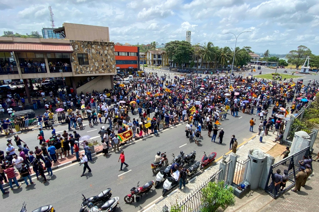 Protestors demonstrate outside Galle International Cricket Stadium but the Test series against Australia has not been affected by the political turmoil