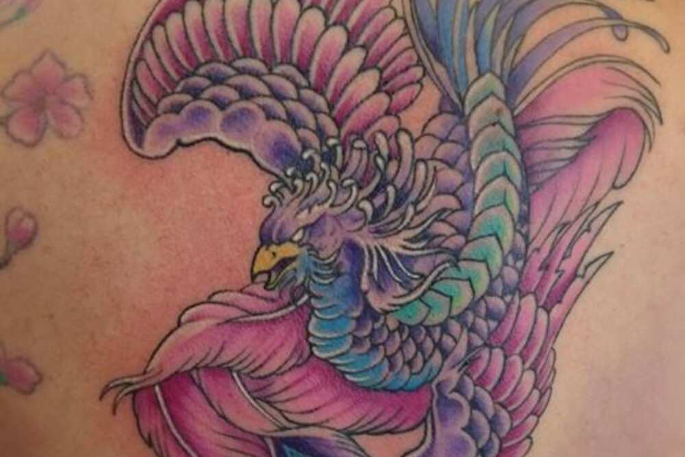 feminine rebirth phoenix tattoo