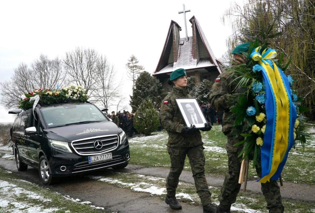 Polish soldiers lead the funeral cortege on Saturday