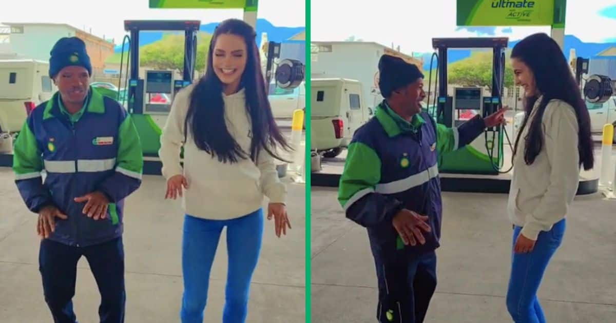 A BP petrol attendant dances with a woman