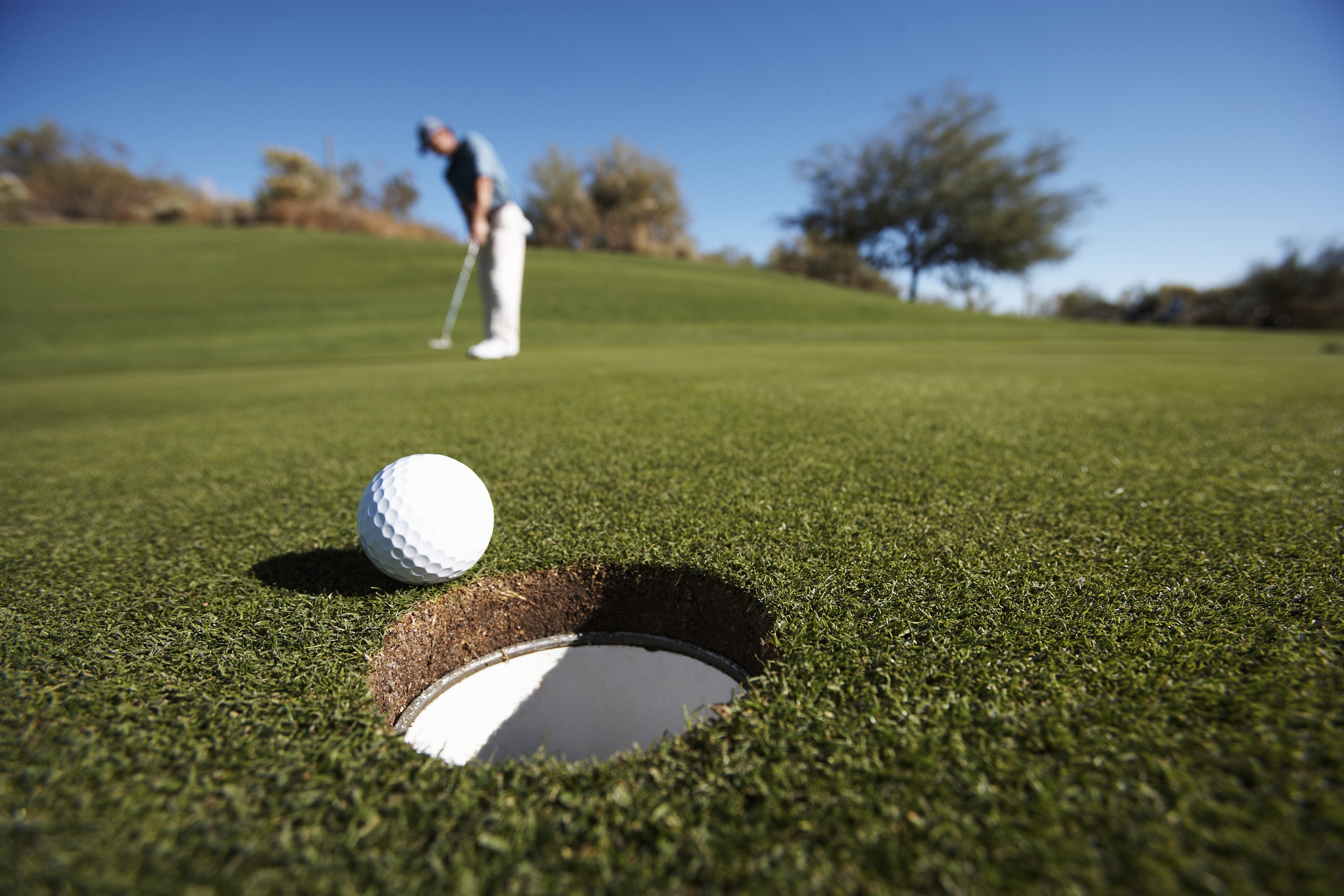 Golf ball on the green grass field.