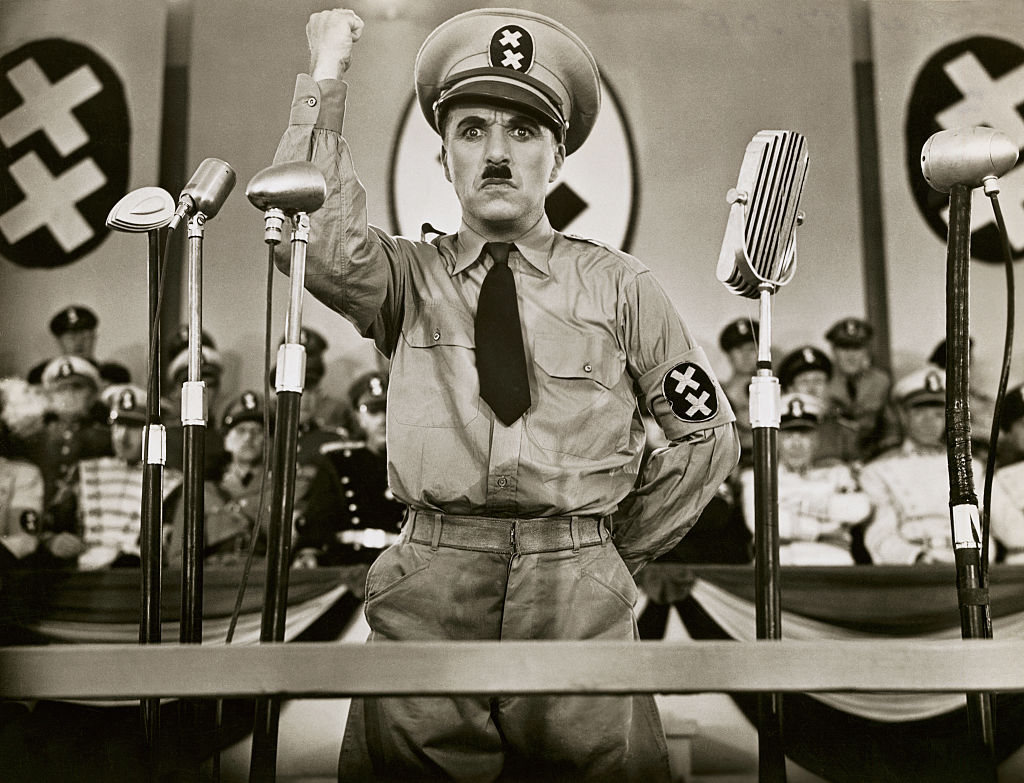 Charlie Chaplin acting as a dictator