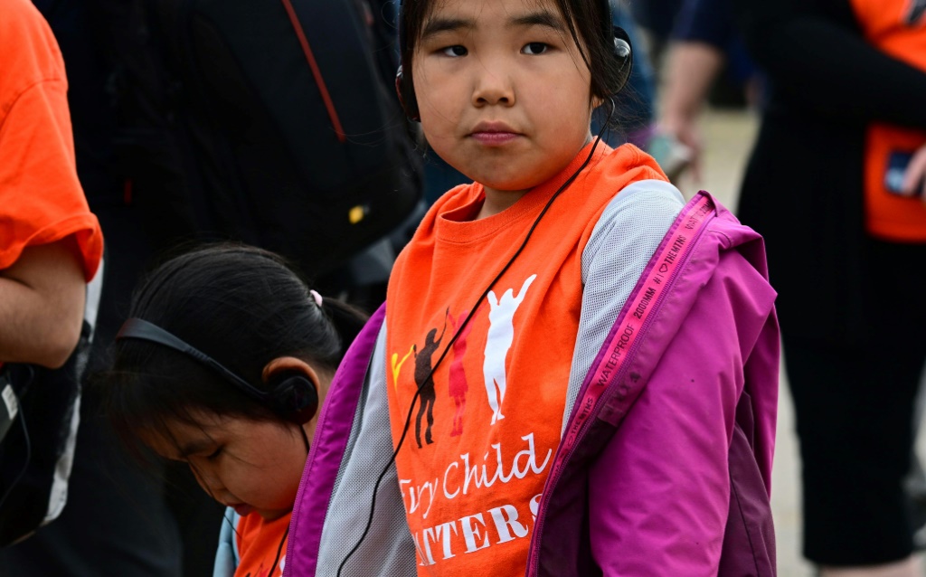 A young girl wearing a shirt reading "Every Child Matters" awaits the arrival of Pope Francis in Iqaluit, Nunavut, Canada, on July 29, 2022