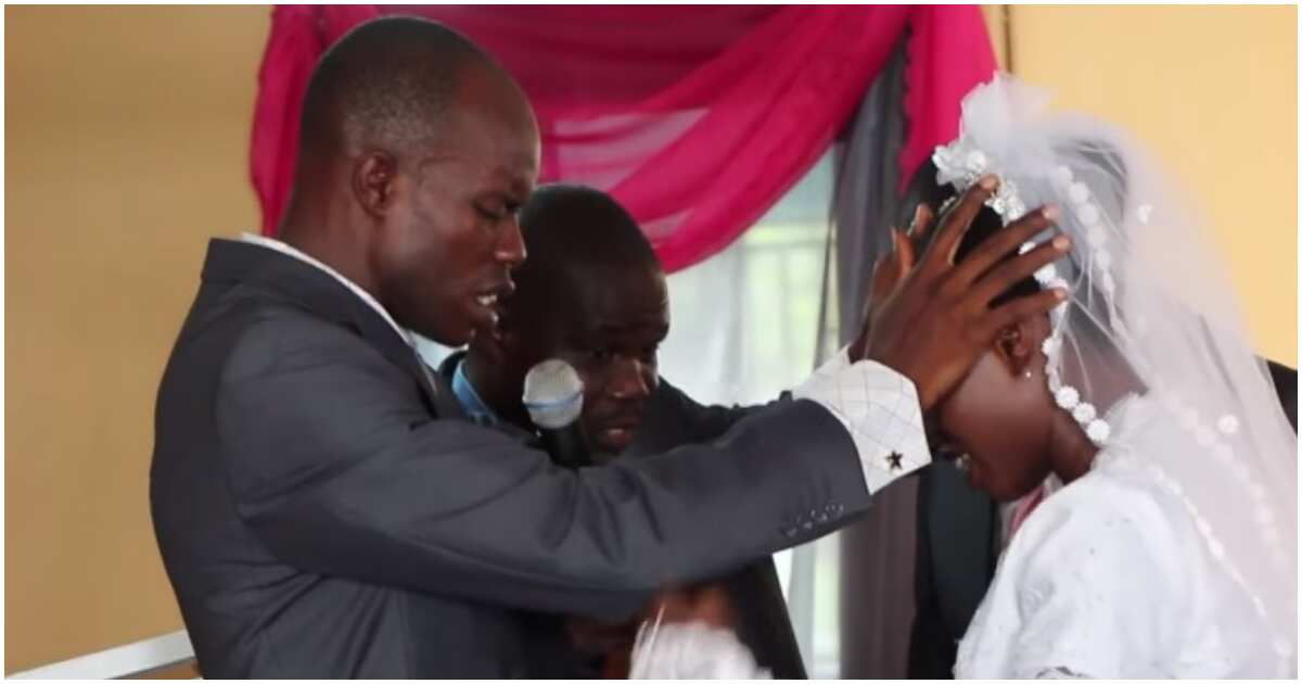 Video shows groom praying in tongues on bride on wedding day